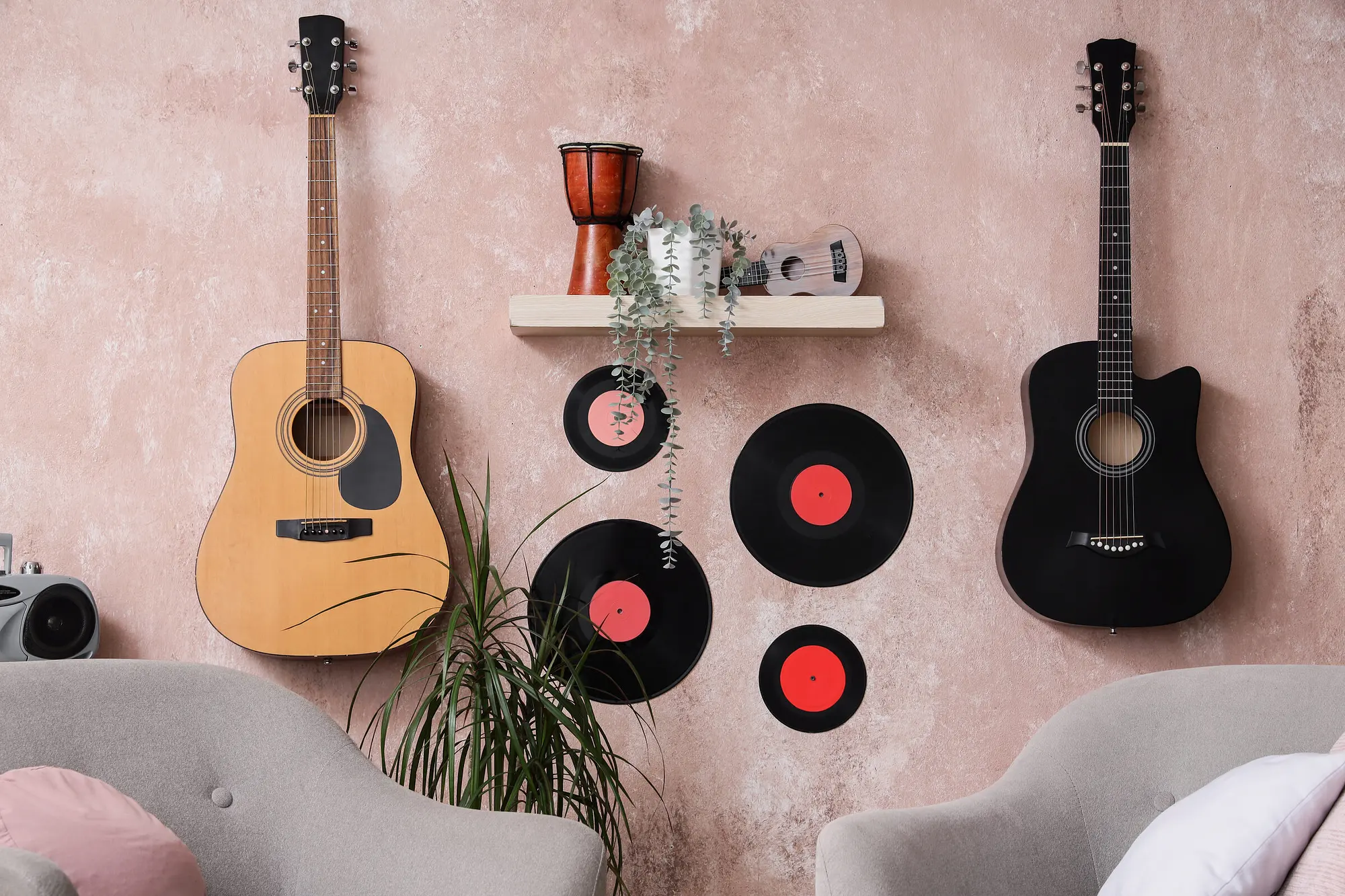 Wide shot — a personal assistant resetting a living room, cases by the wall